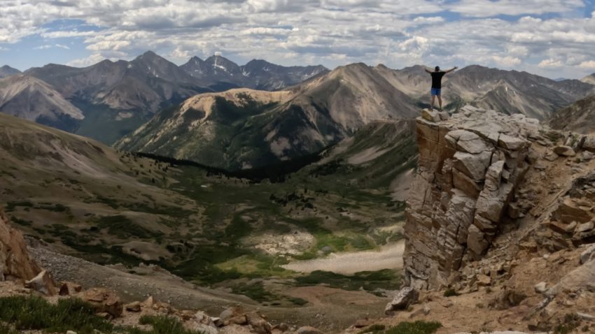 A hiker takes in the views of the Sawatch Range from La Plata Peak's Southwest Ridge trail.